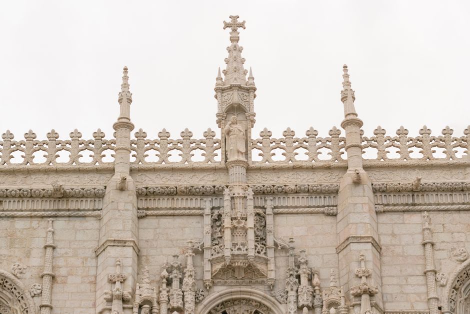 Detailed view of the intricate Gothic facade of Jerónimos Monastery in Lisboa, Portugal.